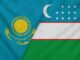 Bandeiras do Cazaquistão e do Uzbequistão lado a lado, simbolizando cooperação bilateral e parceria estratégica na Ásia Central.